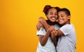 Emotional african american brother and sister embracing and smiling Royalty Free Stock Photo