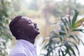 Emotional african  man laughing in wind Royalty Free Stock Photo
