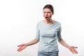 Emotional angry girl standing isolated on white background Royalty Free Stock Photo