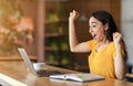 Emotional arab girl got job, shouting in front of laptop Royalty Free Stock Photo