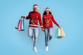 Emotional black couple with shopping bags buying xmas presents Royalty Free Stock Photo