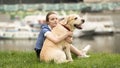 Emotional black and white portrait of a sad lonely girl hugging her dog Royalty Free Stock Photo