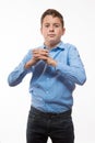 Emotional boy brunette in a blue shirt Royalty Free Stock Photo