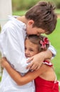 Emotional brother hugging sister in the park outdoors Royalty Free Stock Photo