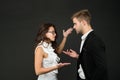 Emotional business conversation between businesswoman and businessman in formalwear dark background, negotiating