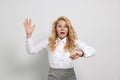 Emotional businesswoman in turmoil over being late on white background Royalty Free Stock Photo