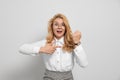 Emotional businesswoman in turmoil over being late on white background Royalty Free Stock Photo