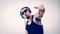 Emotional and charismatic DJ - rapper in headphones takes the ra Royalty Free Stock Photo