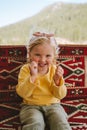 Emotional child girl happy smiling kid blonde hair outdoor 3 years old toddler having fun family lifestyle Royalty Free Stock Photo