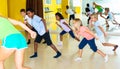 Emotional children performing modern dance in fitness studio