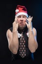Emotional Comic actor man in cap with braids gesticulates, in anticipation of Christmas and New Year Royalty Free Stock Photo