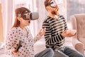 Emotional couple watching movie in virtual reality devic Royalty Free Stock Photo