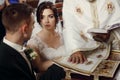 Emotional couple at wedding ceremony in christian catholic church, taking vows with priest and holy bible at the altar, faces Royalty Free Stock Photo