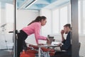 Emotional couple of young colleagues arguing in modern office. Business woman shouting at her sad man assistant, copy Royalty Free Stock Photo