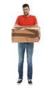 Emotional courier with damaged cardboard box on background. Poor quality delivery service Royalty Free Stock Photo