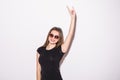 Emotional fashion crazy girl in black t-shirt and rock sunglasses scream holding her head Rocky woman gray background