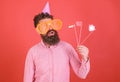 Emotional diversity concept. Guy in party hat celebrate, posing with photo props. Hipster in giant sunglasses Royalty Free Stock Photo