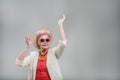 Emotional elderly woman wearing sunglasses Royalty Free Stock Photo