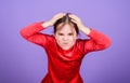 Emotional face small girl violet background. Can not stop her feelings. Lost emotional control. Girl little child Royalty Free Stock Photo