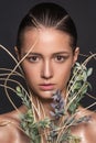 Emotional fashion portrait of beautiful women with bright makeup on wet face. Studio photo on a black background.