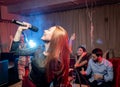 Emotional female singer in karaoke bar Royalty Free Stock Photo