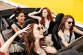 Emotional four young women friends sitting in car Royalty Free Stock Photo