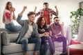 Emotional friends playing video games Royalty Free Stock Photo