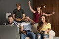 Emotional friends playing video games Royalty Free Stock Photo