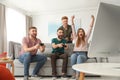 Emotional friends playing video games Royalty Free Stock Photo