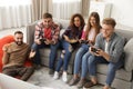 Emotional friends playing video games Royalty Free Stock Photo