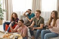 Emotional friends playing video games Royalty Free Stock Photo