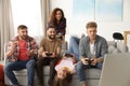 Emotional friends playing video games Royalty Free Stock Photo