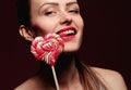 emotional girl with a lollipop over pink background Royalty Free Stock Photo