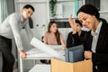 An emotional image of a fired employee packing up her possessions for not being competent