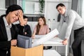 An emotional image of a fired employee packing up her possessions for not being competent