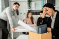 An emotional image of a fired employee packing up her possessions for not being competent