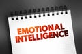 Emotional intelligence - ability to perceive, use, understand, manage, and handle emotions, text concept on notepad