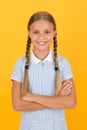 Emotional intelligence describes ability monitor your own emotions. Smiling girl. Adorable schoolgirl yellow background Royalty Free Stock Photo