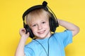 The emotional kid in ear-phones Royalty Free Stock Photo