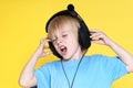 The emotional kid in ear-phones Royalty Free Stock Photo