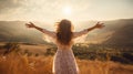 Emotional Liberation: A woman in a white dress stands atop a hill, her arms outstretched, her face radiating joy and Royalty Free Stock Photo