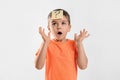 Emotional little boy with question mark on white background Royalty Free Stock Photo