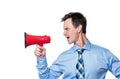 Emotional male businessman in a shirt and tie shouting into a red megaphone, isolated on white background