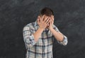 Emotional stressed man portrait on dark background Royalty Free Stock Photo