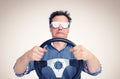 Emotional man in opaque aluminum glasses with steering wheel. Front view. Car driver concept Royalty Free Stock Photo