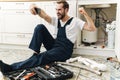 Emotional man plumber take a selfie by mobile phone Royalty Free Stock Photo