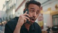 Emotional man yelling smartphone call at city closeup. Gentleman arguing phone Royalty Free Stock Photo