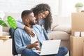 Emotional married couple checking interior ideas for new apartment online Royalty Free Stock Photo