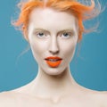 Emotional portrait of beautiful girl with orange hair