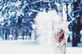 Emotional portrait of a little girl throws snow Royalty Free Stock Photo